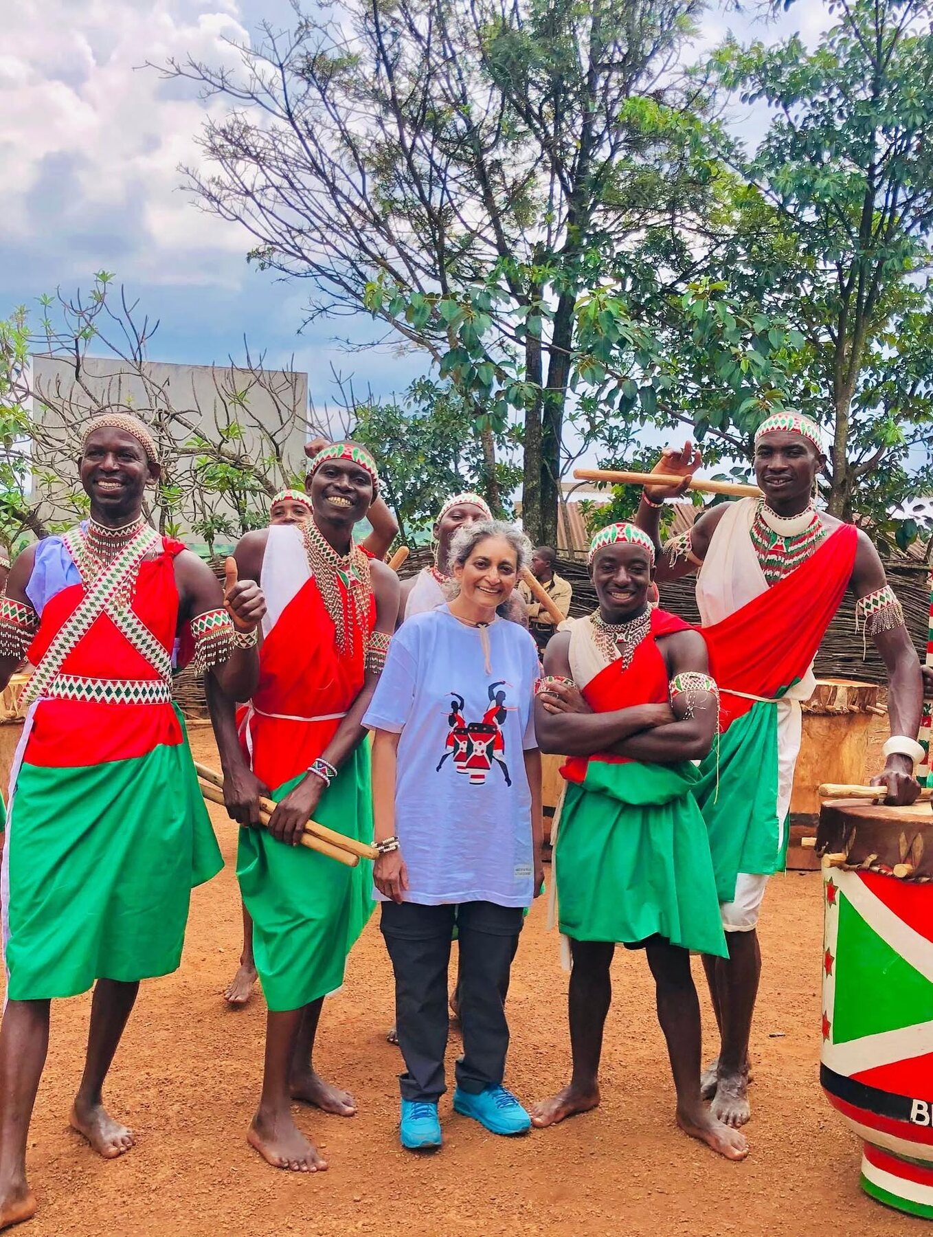 Visitor meeting members of the Gishora royal drum ensemble
